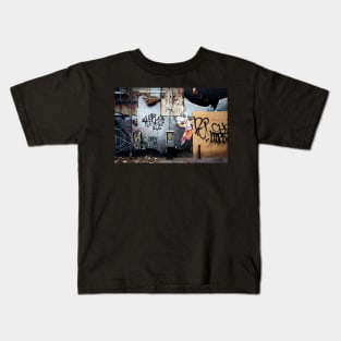 Decaying urban brick wall with graffiti paint and street art in New York City Kids T-Shirt